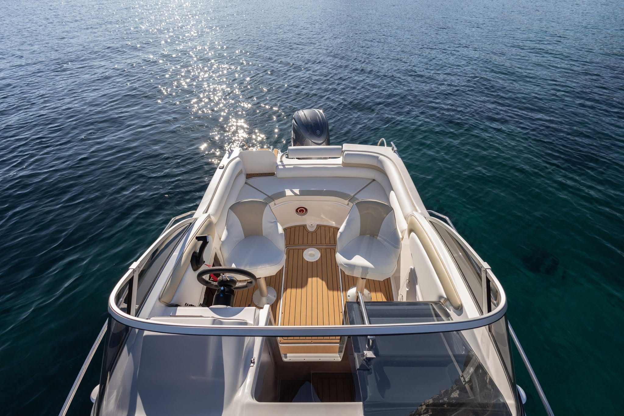 Overhead view of the boat's cockpit and teak deck