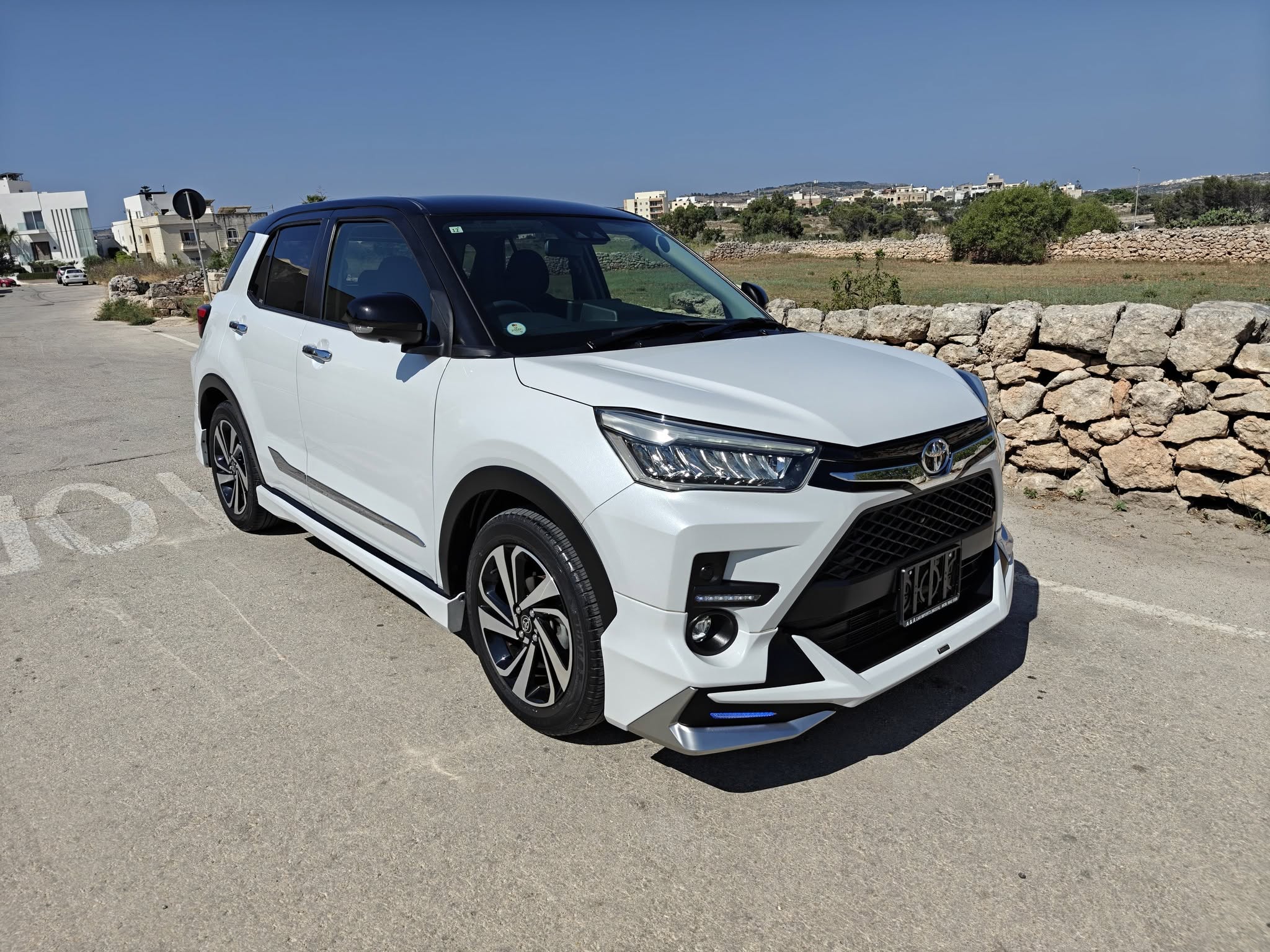 White Toyota Raize, front three-quarter view